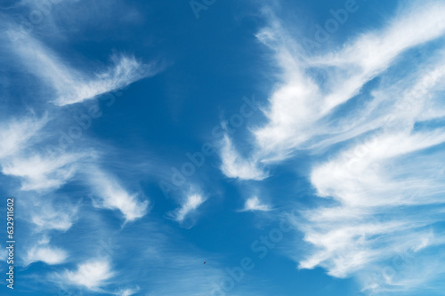 Beautiful blue sky with gentle white clouds. Aerial background view from of clear blue skies and white faint clouds