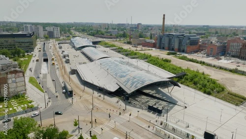 Railway station Lodz Fabryczna, visible from a drone perspective. Around, there are urban buildings, public transport, and office buildings. Drone, Urban, Cityscape, City center, Public transit hub