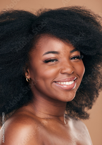 Portrait, hair care and black woman with beauty, shine and wellness on brown studio background. Growth, person or African model with texture, afro or cosmetics with aesthetic, face or smile with glow