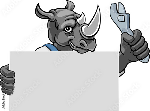 A rhino handyman, mechanic, plumber or other construction cartoon mascot man holding a wrench or spanner tool.