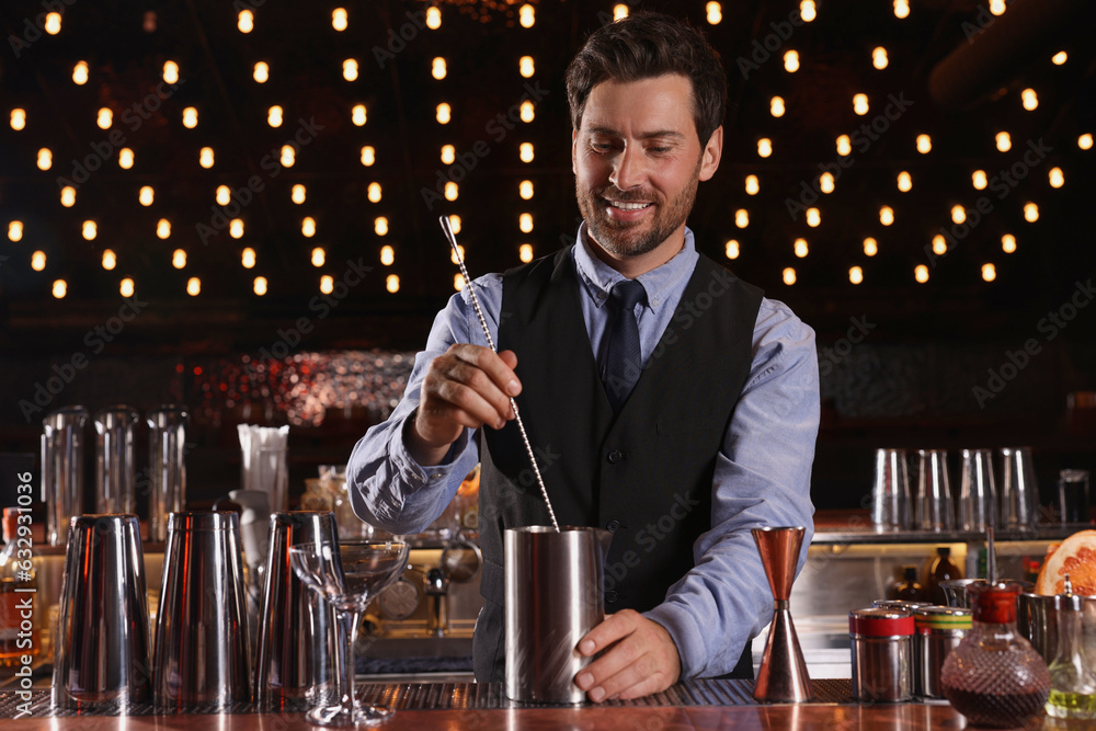 Bartender preparing fresh alcoholic cocktail in bar Bartender preparing fresh alcoholic cocktail in bar