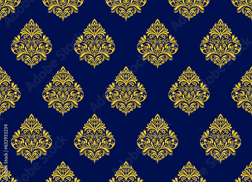 Damask floral yellow motif pattern on a dark blue background. Luxury wallpaper texture ornament decor. Baroque Textile  fabric  tiles.