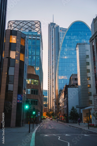 Photography Urban city street amidst buildings in the financial district on a bright sunny m