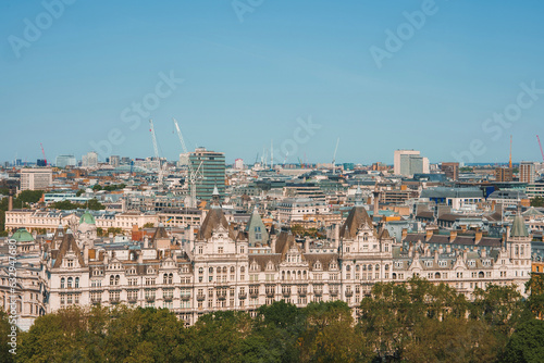 The Royal Horseguards hotel in London. Residential buildings in city. Houses under clear blue sky on sunny day.