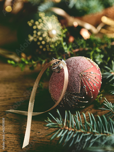 Vintage Christmas ornaments with spruce twigs on rustic wooden table