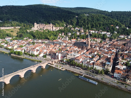 Aerial photograph of Heidelberg old town with the Castle in the background and the Heiliggeistkirche church and old bridge in the foreground, Baden-Württemberg, Germany