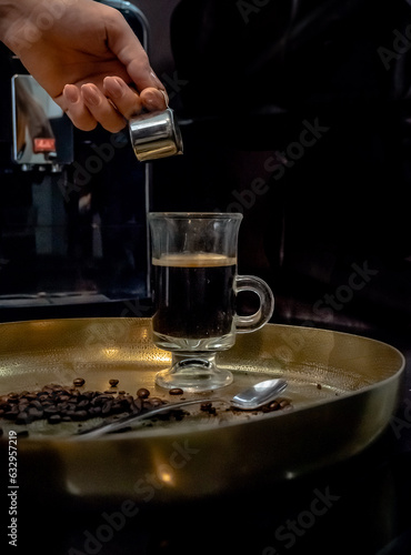 turkish strong coffee in a glass from a cafe