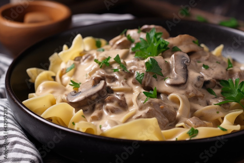 Beef Stroganoff, a rich and creamy meal, served in a white ceramic bowl and garnished with fresh parsley.