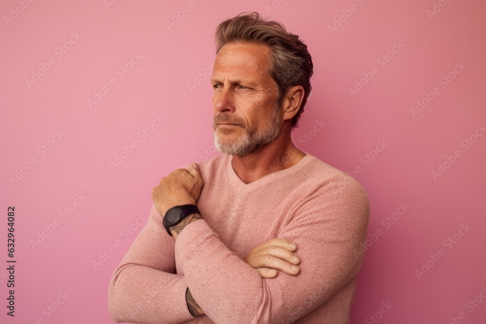 Medium shot portrait photography of a man in his 40s scratching his arm due to atopic dermatitis wearing a chic cardigan against a pastel or soft colors background Medium shot portrait photography of a man in his 40s scratching his arm due to atopic dermatitis wearing a chic cardigan against a pastel or soft colors background