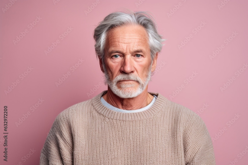Medium shot portrait photography of a man in his 50s with a hint of fatigue due to chronic kidney disease wearing a cozy sweater against a pastel or soft colors background Medium shot portrait photography of a man in his 50s with a hint of fatigue due to chronic kidney disease wearing a cozy sweater against a pastel or soft colors background