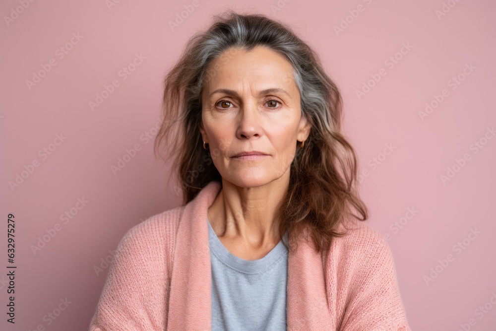 Medium shot portrait photography of a woman in her 40s showing tiredness and a worn-down expression due to chronic fatigue syndrome wearing a chic cardigan against a pastel or soft colors background Medium shot portrait photography of a woman in her 40s showing tiredness and a worn-down expression due to chronic fatigue syndrome wearing a chic cardigan against a pastel or soft colors background