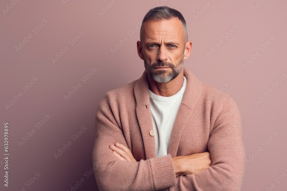 Medium shot portrait photography of a man in his 40s with a somber and deeply sad expression due to major depression wearing a chic cardigan against a pastel or soft colors background Medium shot portrait photography of a man in his 40s with a somber and deeply sad expression due to major depression wearing a chic cardigan against a pastel or soft colors background