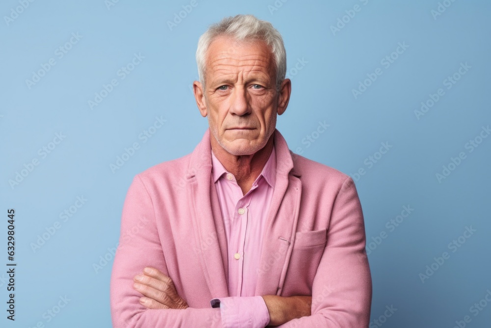 Medium shot portrait photography of a man in his 50s looking anxious and fidgety due to generalized anxiety disorder wearing a chic cardigan against a pastel or soft colors background Medium shot portrait photography of a man in his 50s looking anxious and fidgety due to generalized anxiety disorder wearing a chic cardigan against a pastel or soft colors background