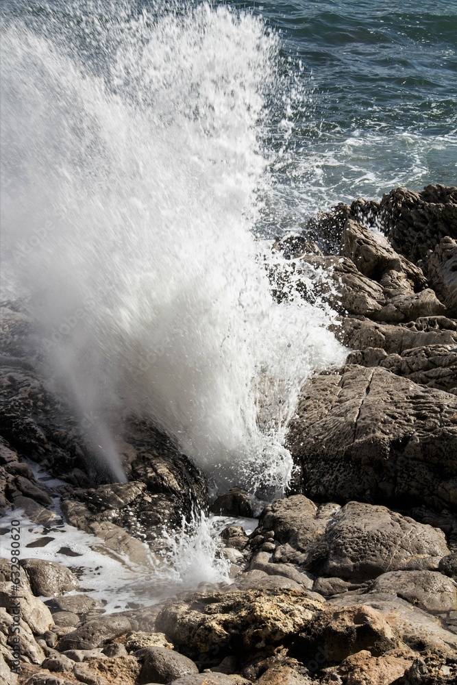 evocative image of a rough sea hitting the rocks in Sicily