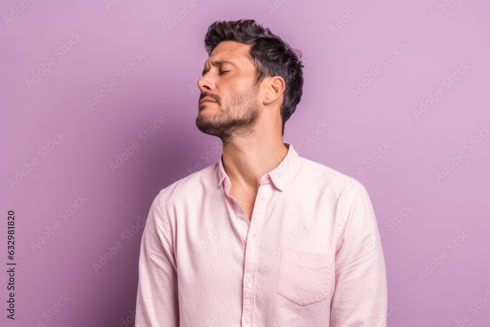 Group portrait photography of a man in his 30s visibly in discomfort and fatigue from an autoimmune disease like lupus wearing a simple tunic against a pastel or soft colors background Group portrait photography of a man in his 30s visibly in discomfort and fatigue from an autoimmune disease like lupus wearing a simple tunic against a pastel or soft colors background