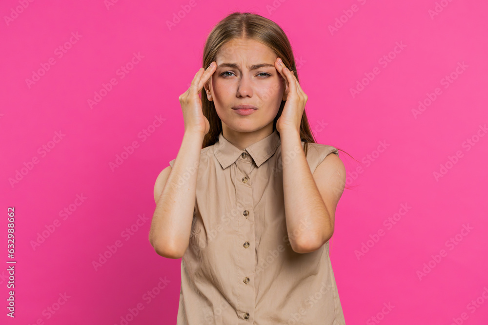 Attractive exhausted young woman girl rubbing temples to cure headache problem, suffering from tension, migaine, stress, grimacing in pain, high blood pressure isolated alone on pink wall background Attractive exhausted young woman girl rubbing temples to cure headache problem, suffering from tension, migaine, stress, grimacing in pain, high blood pressure isolated alone on pink wall background