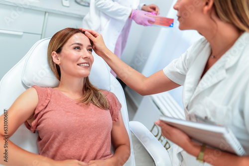 Younge doctor examining a patient.