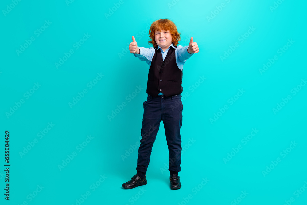 Full size photo of cheerful small person hands fingers demonstrate thumb up approval isolated on teal color background Full size photo of cheerful small person hands fingers demonstrate thumb up approval isolated on teal color background