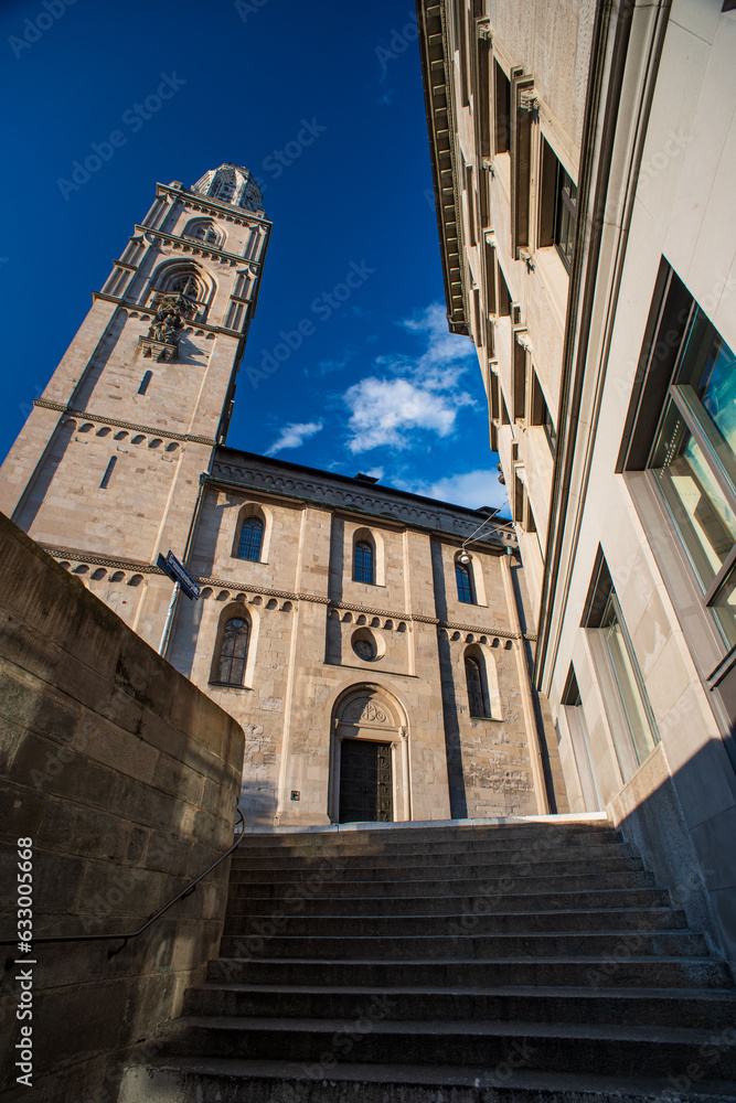 03-08-2023  Zurich city Switzerland. Low and wide-angle view of Grossmunster church, Sunny summer day, blue sky, no people