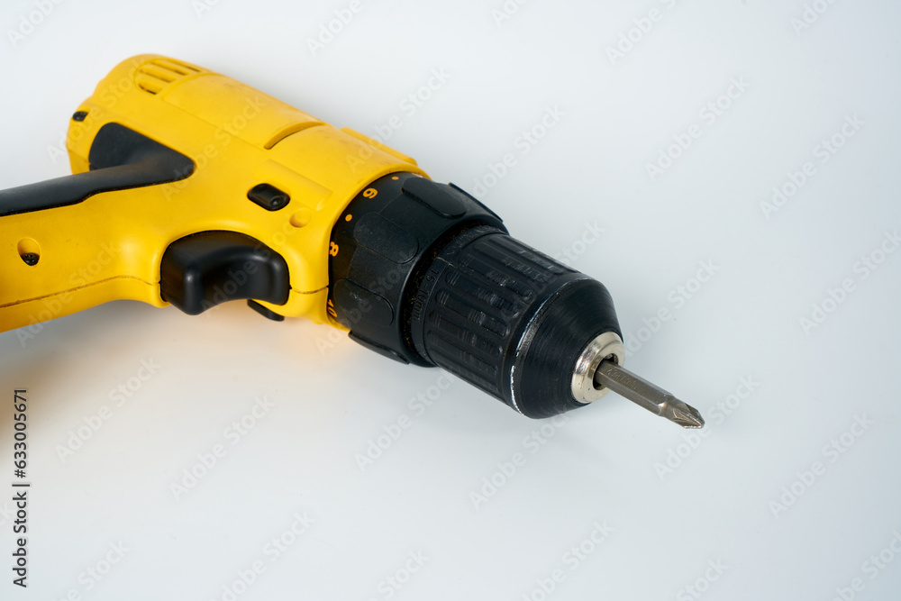 Black and yellow cordless drill on a white isolated background. Black and yellow cordless drill on a white isolated background.