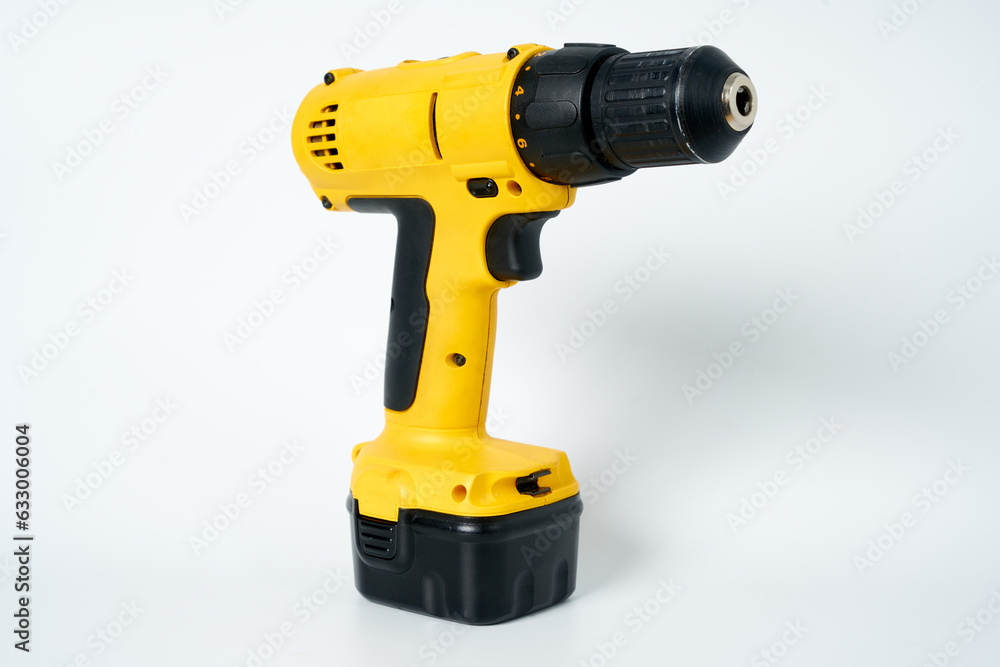 Black and yellow cordless drill on a white isolated background. Black and yellow cordless drill on a white isolated background.