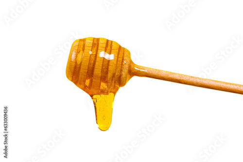 Honey dripping from honey dipper isolated on transparent background. Thick honey dipping from the wooden honey spoon. Healthy food and diet concept