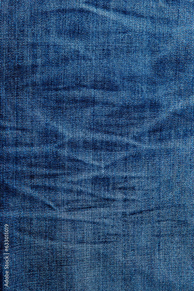 blue denim background with a seam. light blue color denim jeans fabric texture. copy space for text blue denim background with a seam. light blue color denim jeans fabric texture. copy space for text