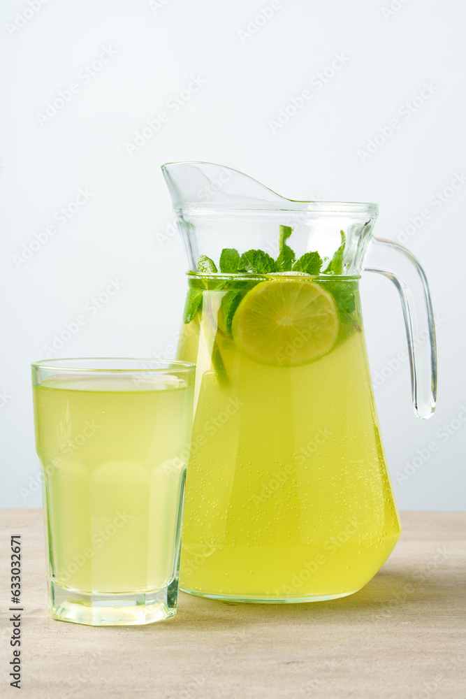 Glass jar of fresh lemonade on table close up Glass jar of fresh lemonade on table close up