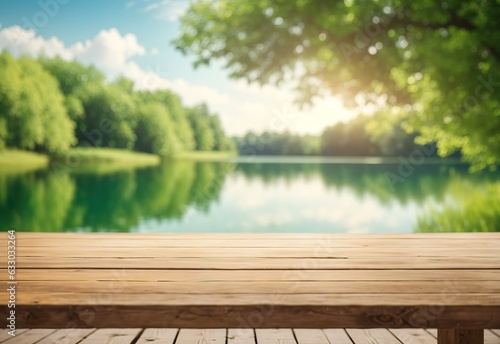 The empty wooden table top with blur summer lakes green forest background