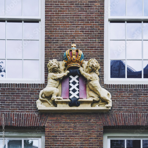 Royal lions holding a crown in Amsterdam. photo