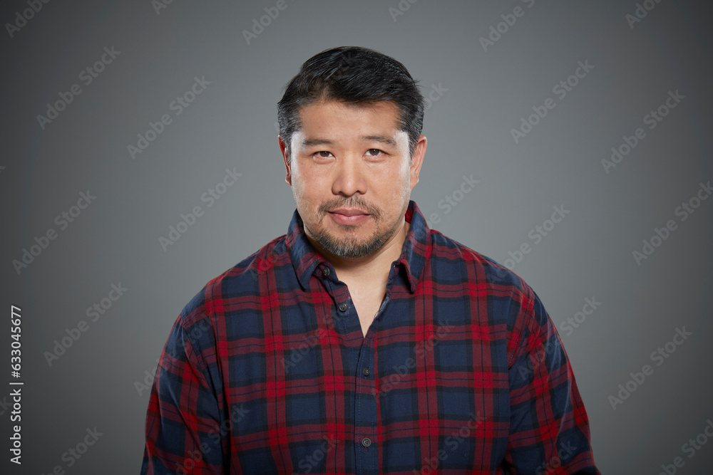 Portrait of man wearing flannel shirt. Portrait of man wearing flannel shirt.