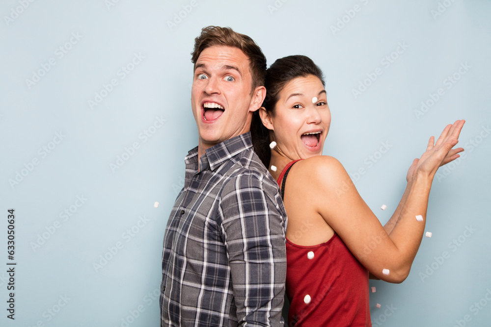 Couple throwing marshmallows Couple throwing marshmallows