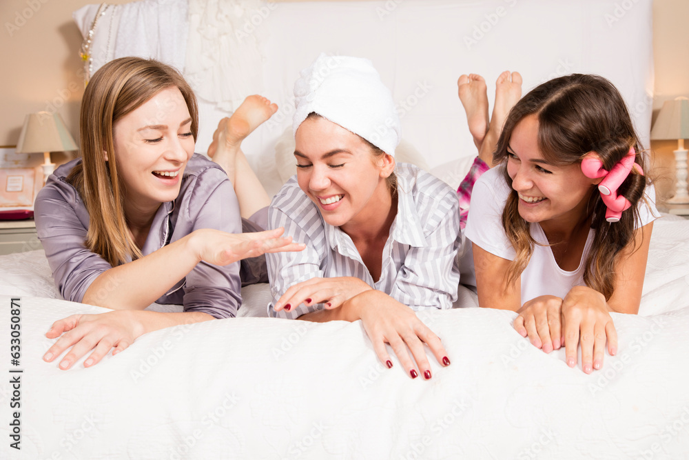 Young women lying on bed Young women lying on bed
