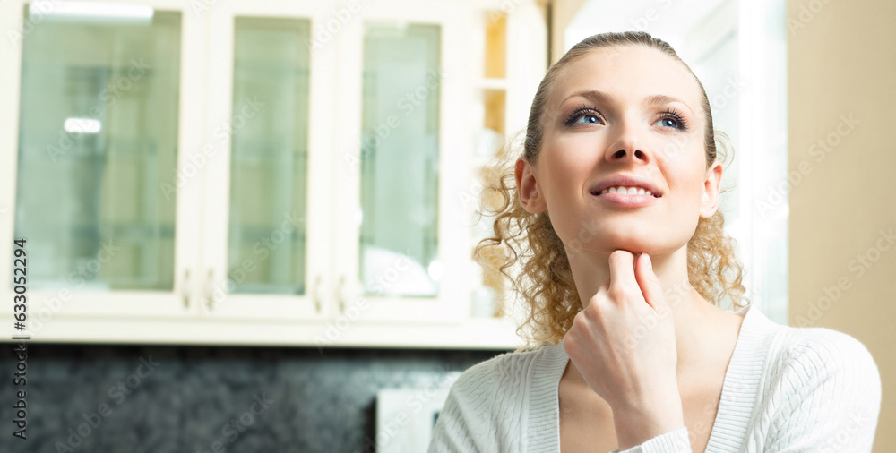 Portrait of young smiling beautiful blond woman thinking, indoors Portrait of young smiling beautiful blond woman thinking, indoors