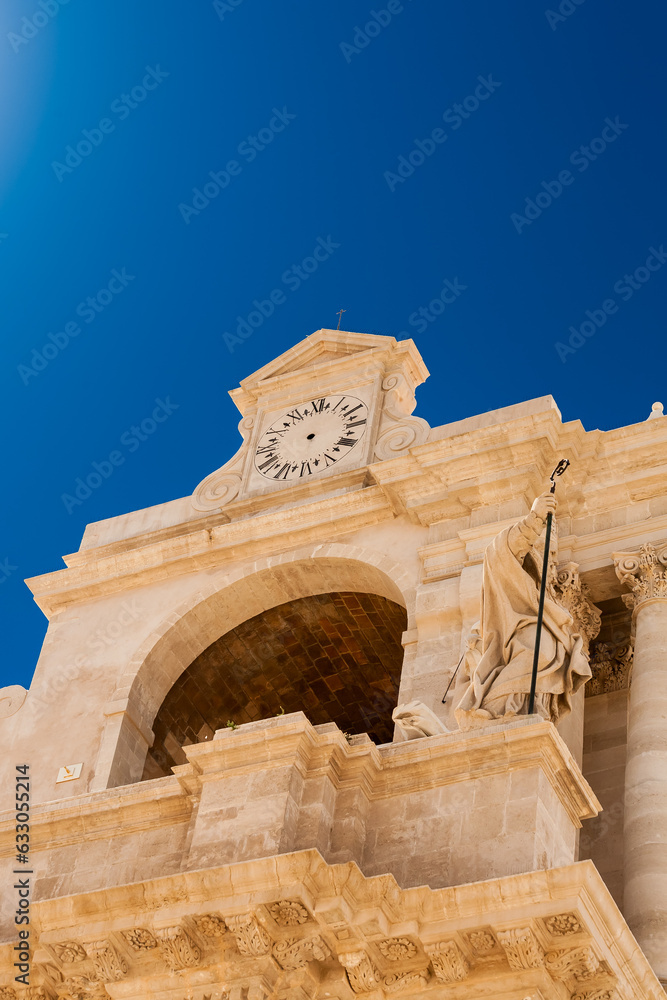 Mannerist style arch with clock on old building