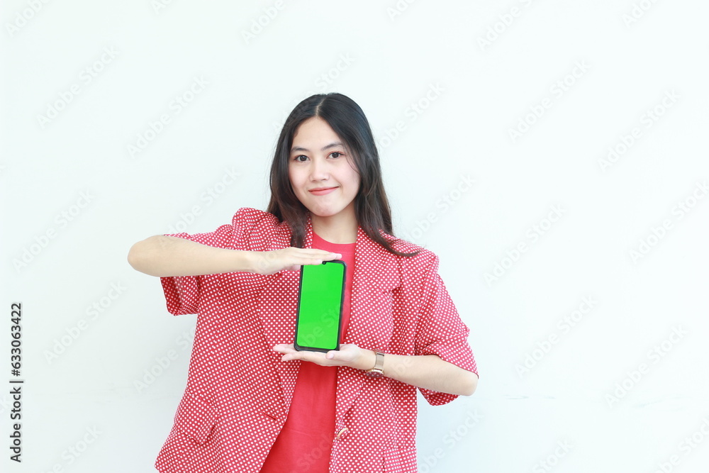 portrait of beautiful asian woman wearing red outfit holding mobile phone and smiling portrait of beautiful asian woman wearing red outfit holding mobile phone and smiling