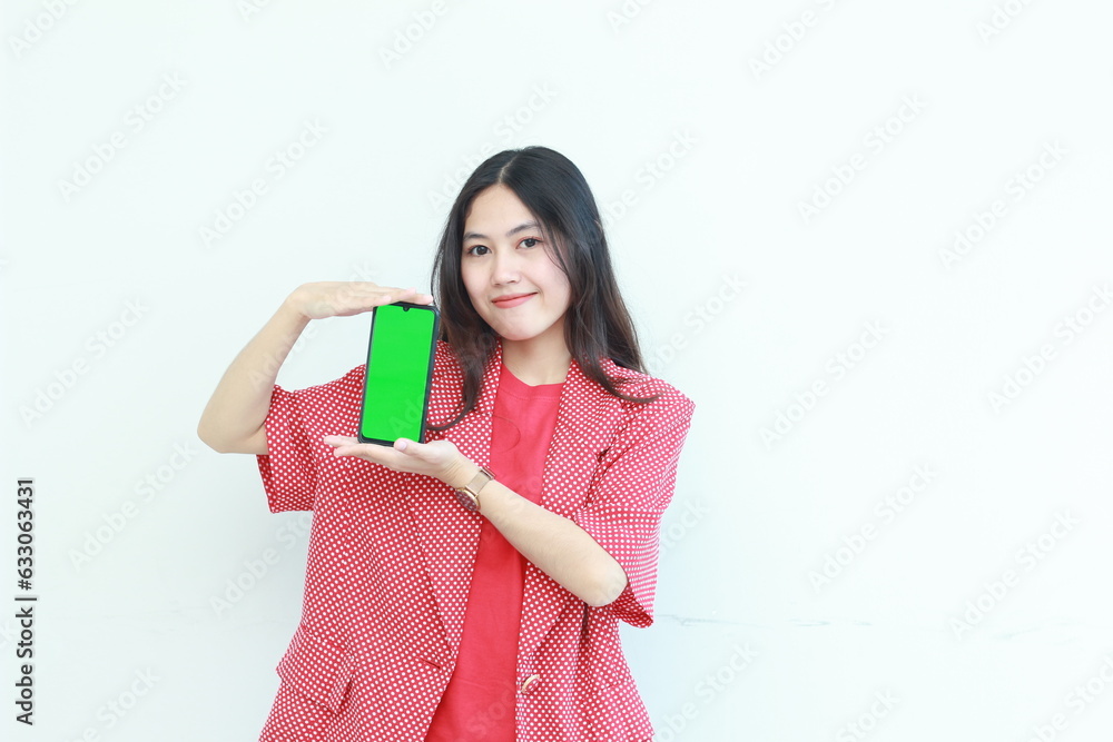portrait of beautiful asian woman wearing red outfit holding mobile phone and smiling portrait of beautiful asian woman wearing red outfit holding mobile phone and smiling