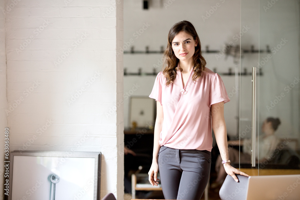 Portrait of young businesswoman in office Portrait of young businesswoman in office