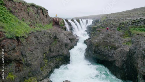 Scenery of Kolugljufur canyon with Kolufossar falls flowing in gorge on summer at Iceland photo