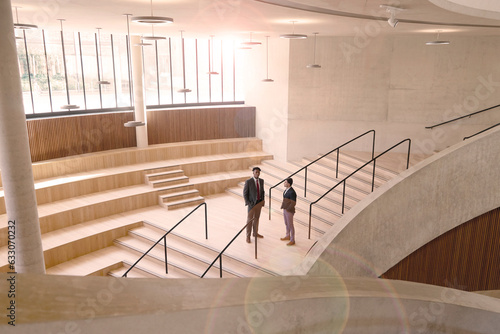 Men talking on staircase at Blavatnik School of Government photo