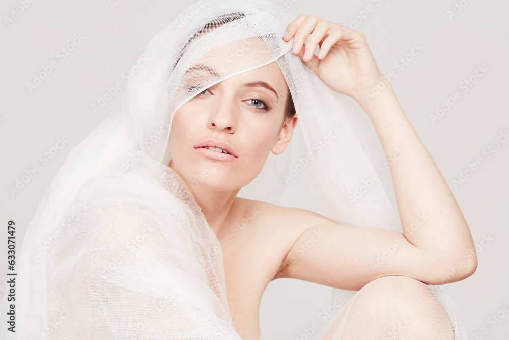 Young woman wrapped in sheer sheet Young woman wrapped in sheer sheet