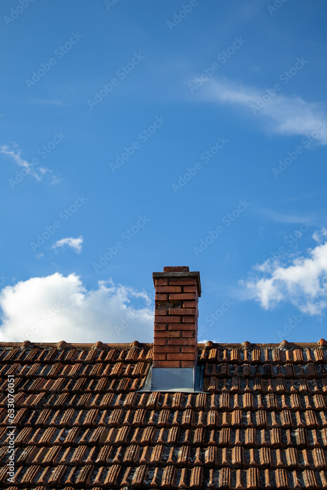 Chimney, roof and blue sky