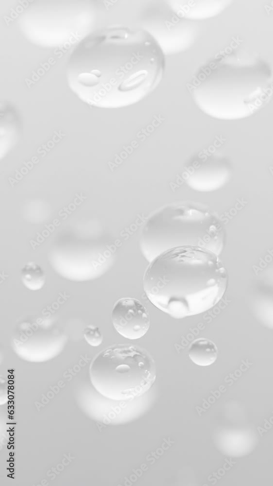 Vertical close up rising up bubbles on white background Vertical close up rising up bubbles on white background