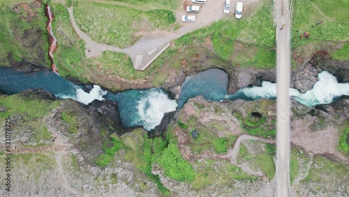 Scenery of Kolugljufur canyon with Kolufossar falls flowing in gorge on summer at northern of Iceland photo