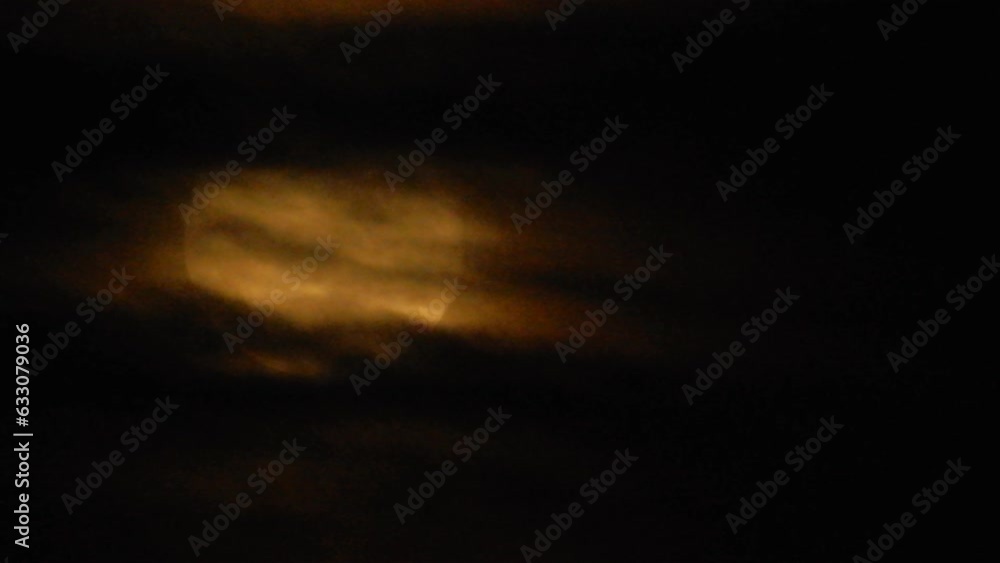 Orange Red Blood Moon With Clouds Passing In Front Orange Red Blood Moon With Clouds Passing In Front
