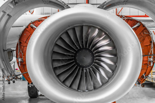 Open airplane engine in hangar photo