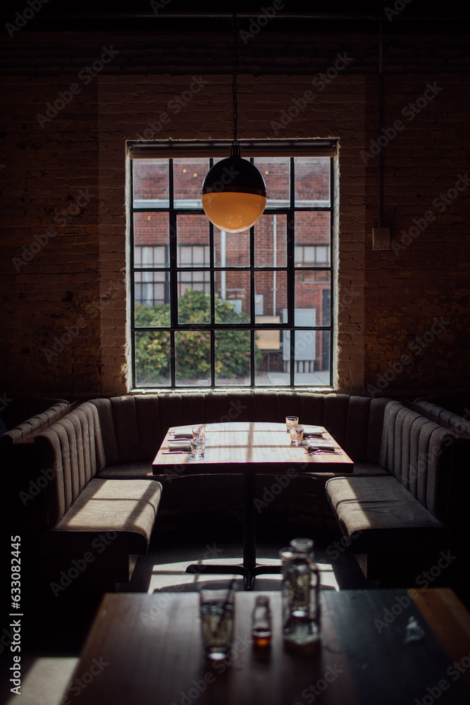 Booth by window in restaurant Stock Photo | Adobe Stock