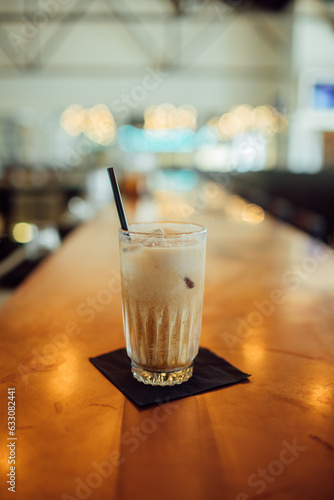 Iced coffee on wooden table