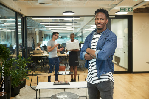 Smiling young businessman in office