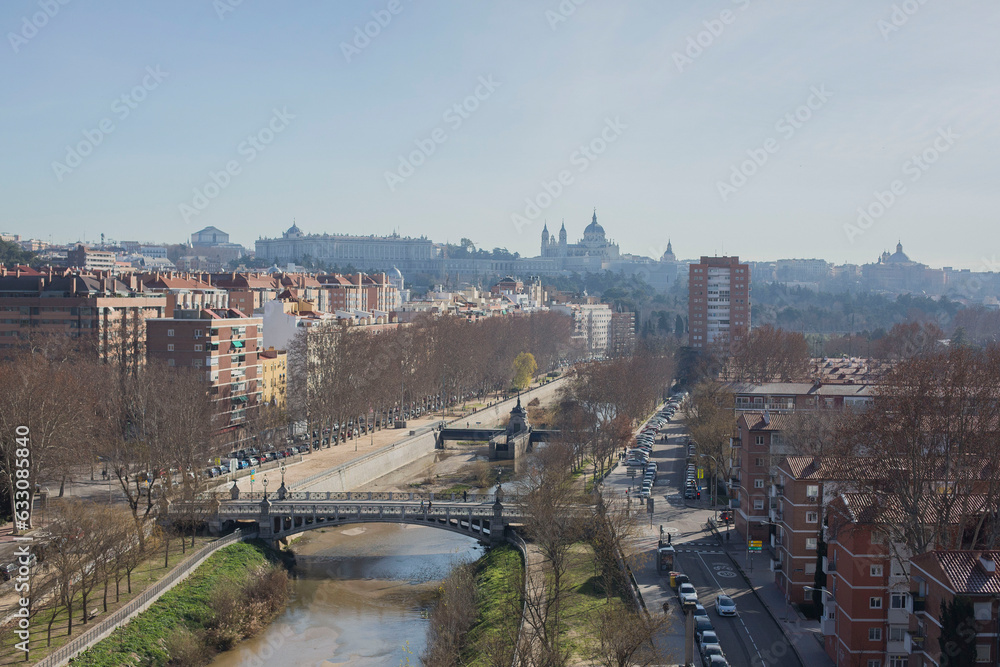 Madrid cityscape with river and bridges running through 